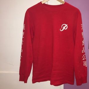 Long sleeve red shirt with Asian writing