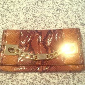 Micheal Kors brown python clutch.