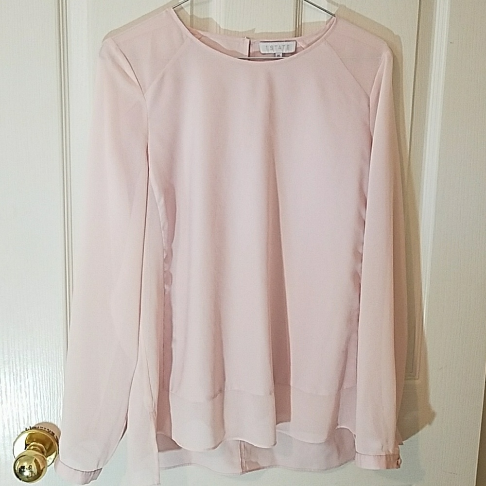 Soft pink polyester blouse.