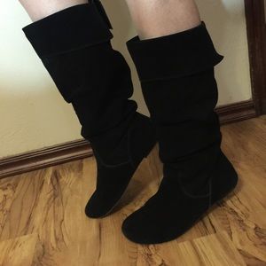 Flat black suede boots.