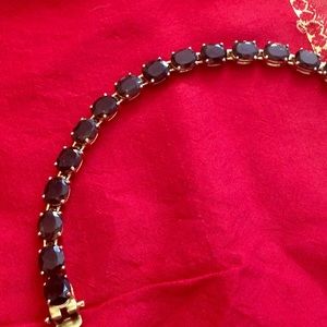 Brown stone and gold toned metal bracelet