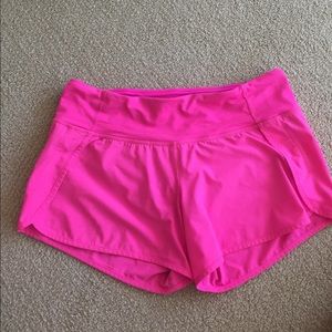 Bright pink Lululemon running shorts