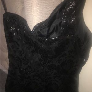 A black goldish cocktail dress