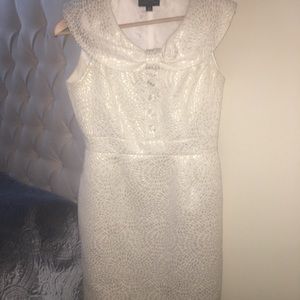 A chic & cute white goldish dress.