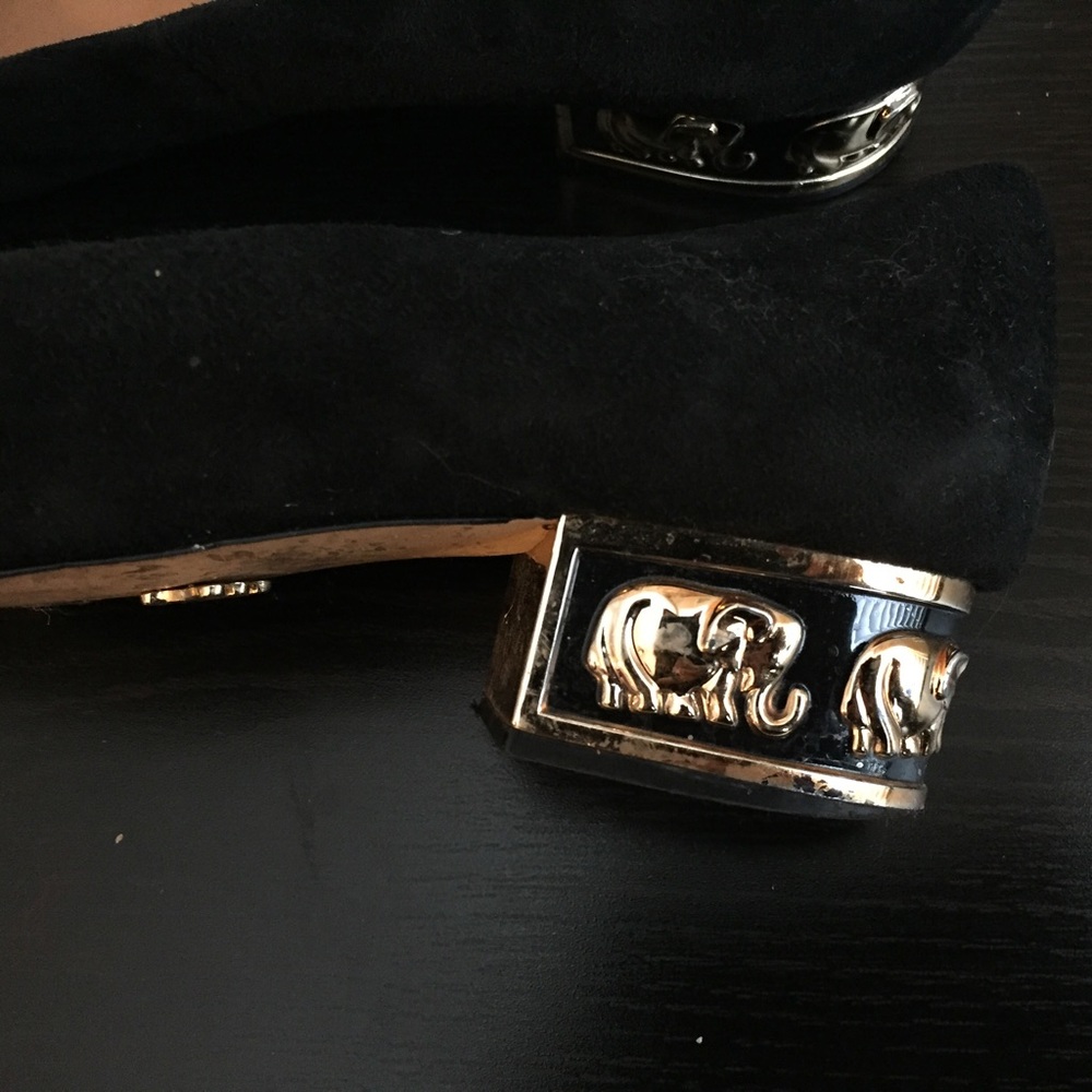 Nina black suede flats with gold elephant details