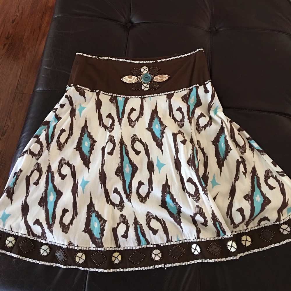 Women's brown and teal beaded skirt.
