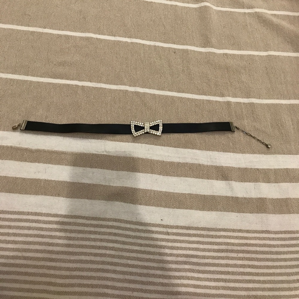 Silver rhinestone bowtie black choker.