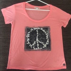 Billabong T-shirt with peace sign. Size: Medium