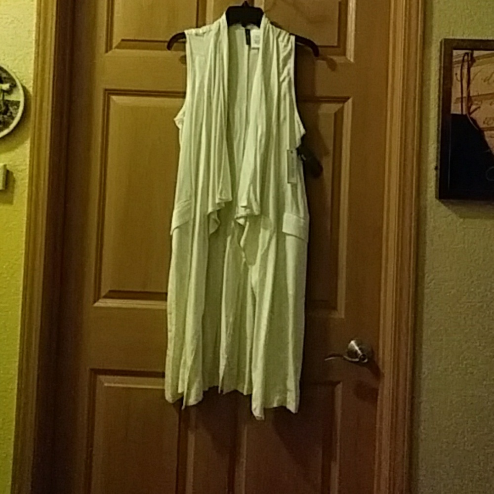 White sleeveless mid length jacket