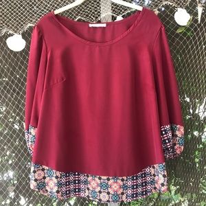 Deep red blouse with mosaic edging