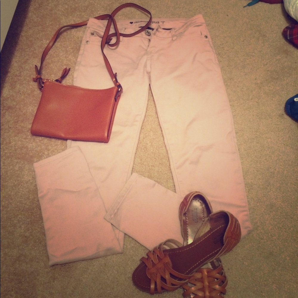 Light mauve colored skinny jeans