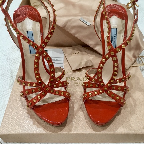 Prada Shoes - Prada heels orange with gold studs. Size 40