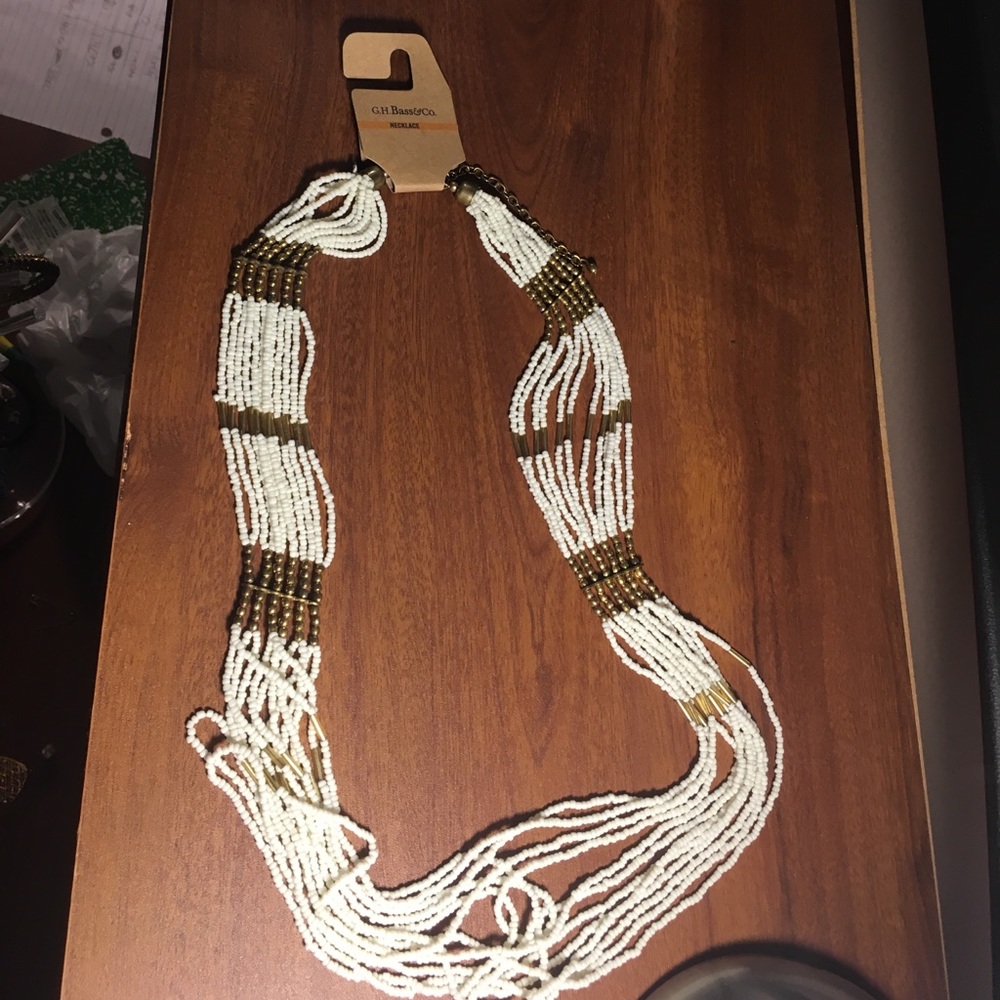 Long beaded white and gold colored necklace