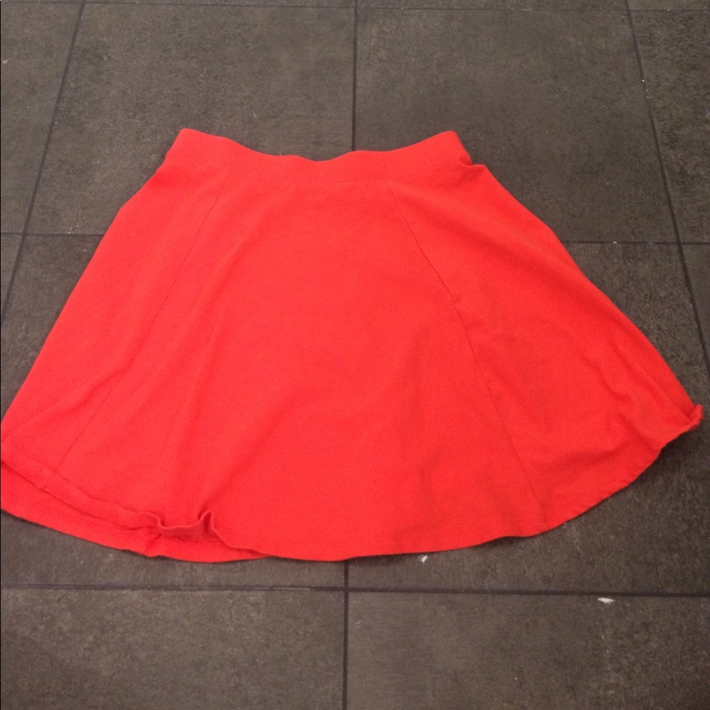 Orange/red skater skirt.