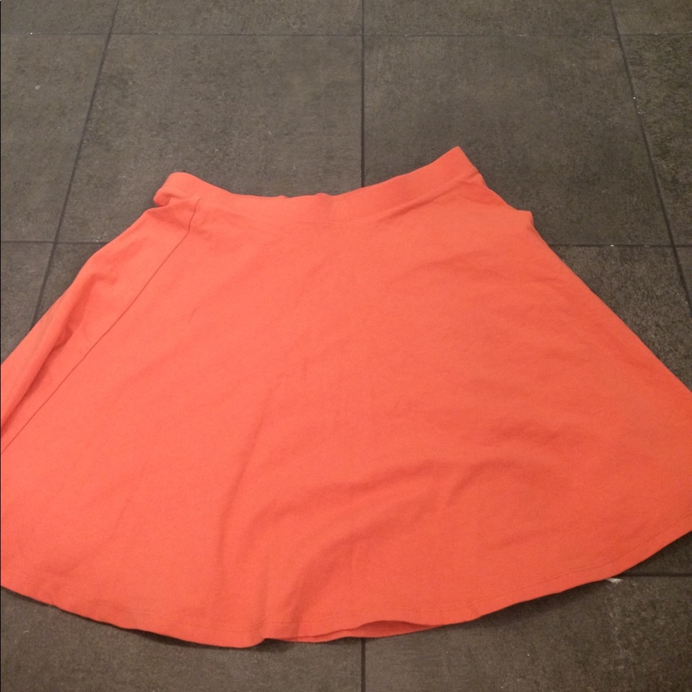 Coral/orange skater skirt.