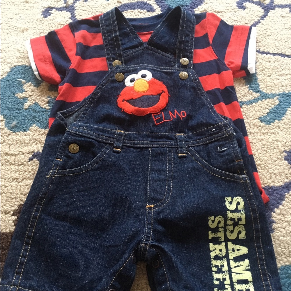 Red Sesame Street elmo t shirt and jean overalls.