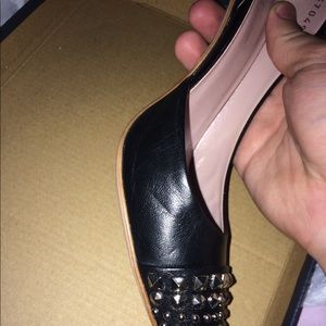 Gucci heels slightly worn.