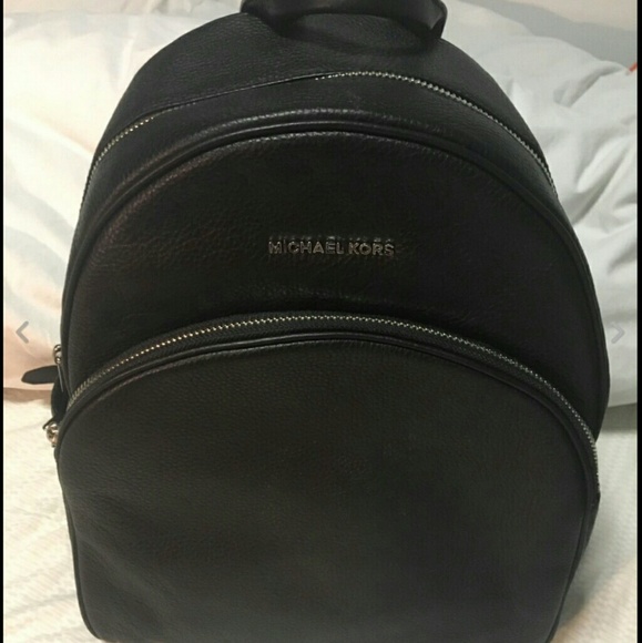 A black Micheal kors backpack