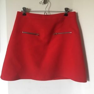 Red mini skirt with silver zippers