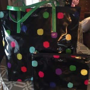 Navy Kate Spade bag with matching cosmetic bag.