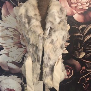 Faux fur vest with belt.