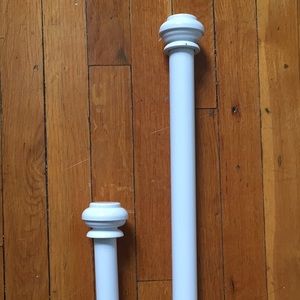 Two white curtain rods