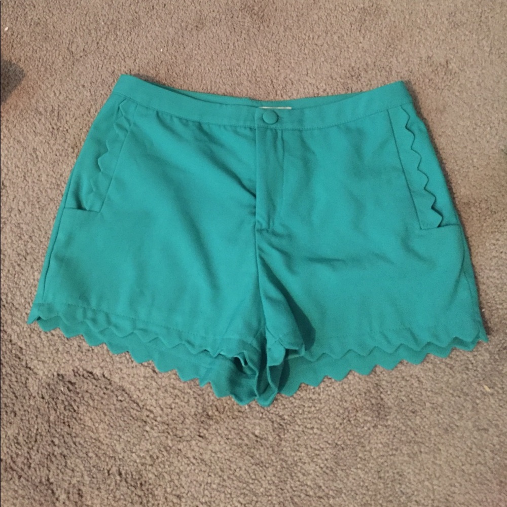 Green scalloped shorts
