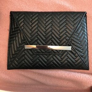 Black faux leather clutch and cross body