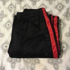 BOYS red and black athletic pants.