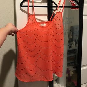 Super cute top! With medal details