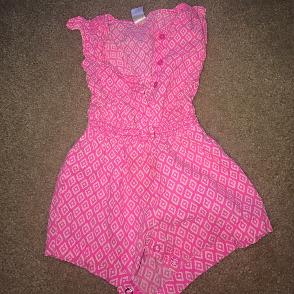 pink and white baby's romper