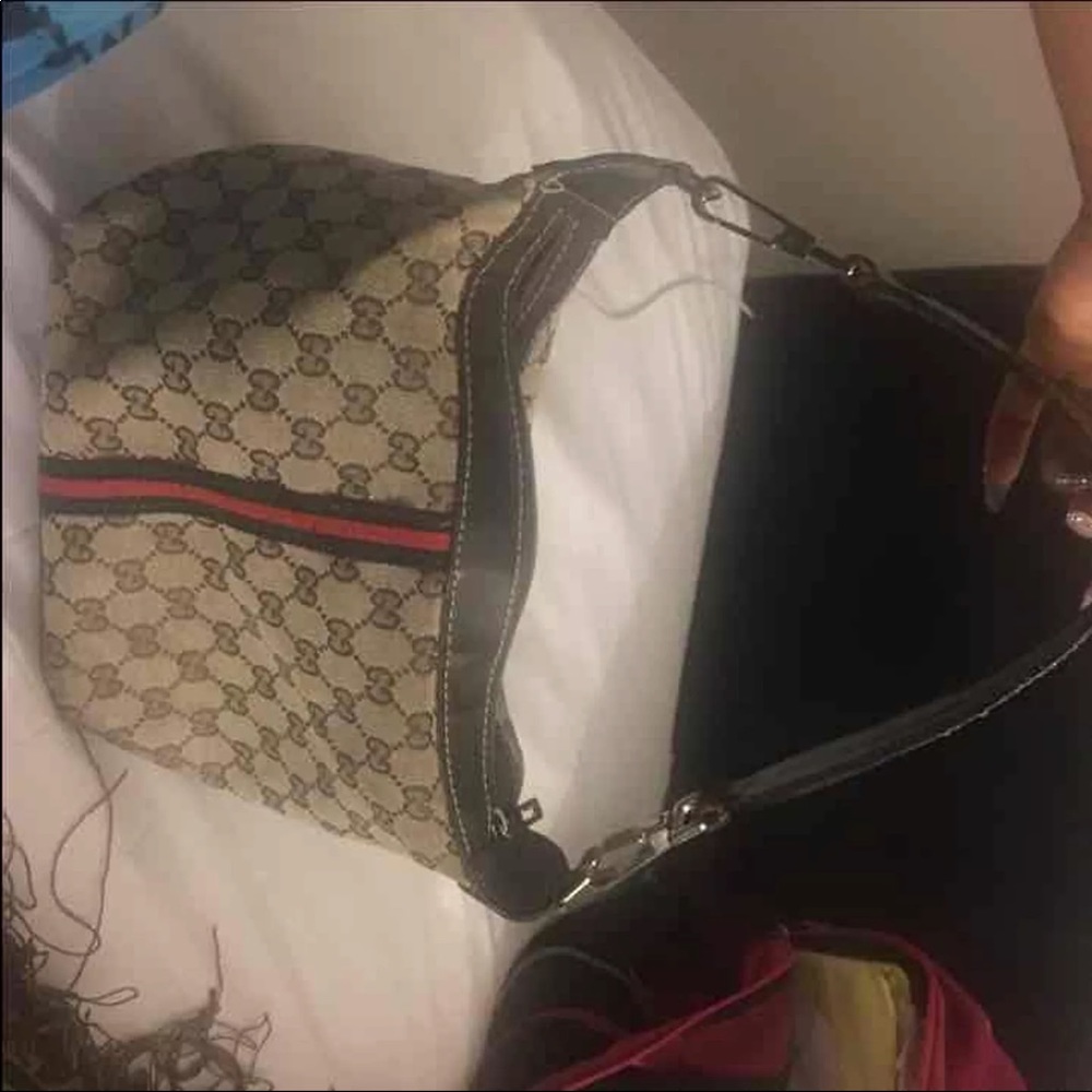 Gucci carrying purse.