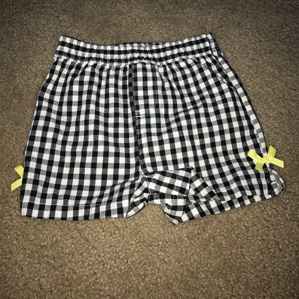 Black and white checkered shorts with yellow bows