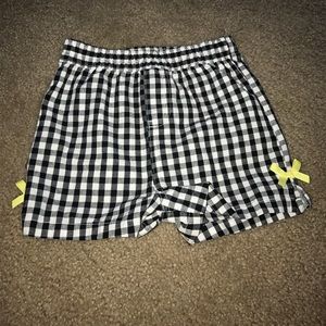 Black and white checkered shorts with yellow bows