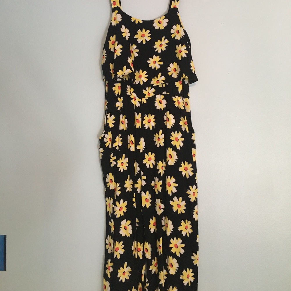 Black romper with white and yellow flowers