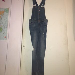 Ripped denim overalls