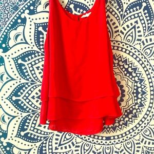 Red silky, loose tank top.