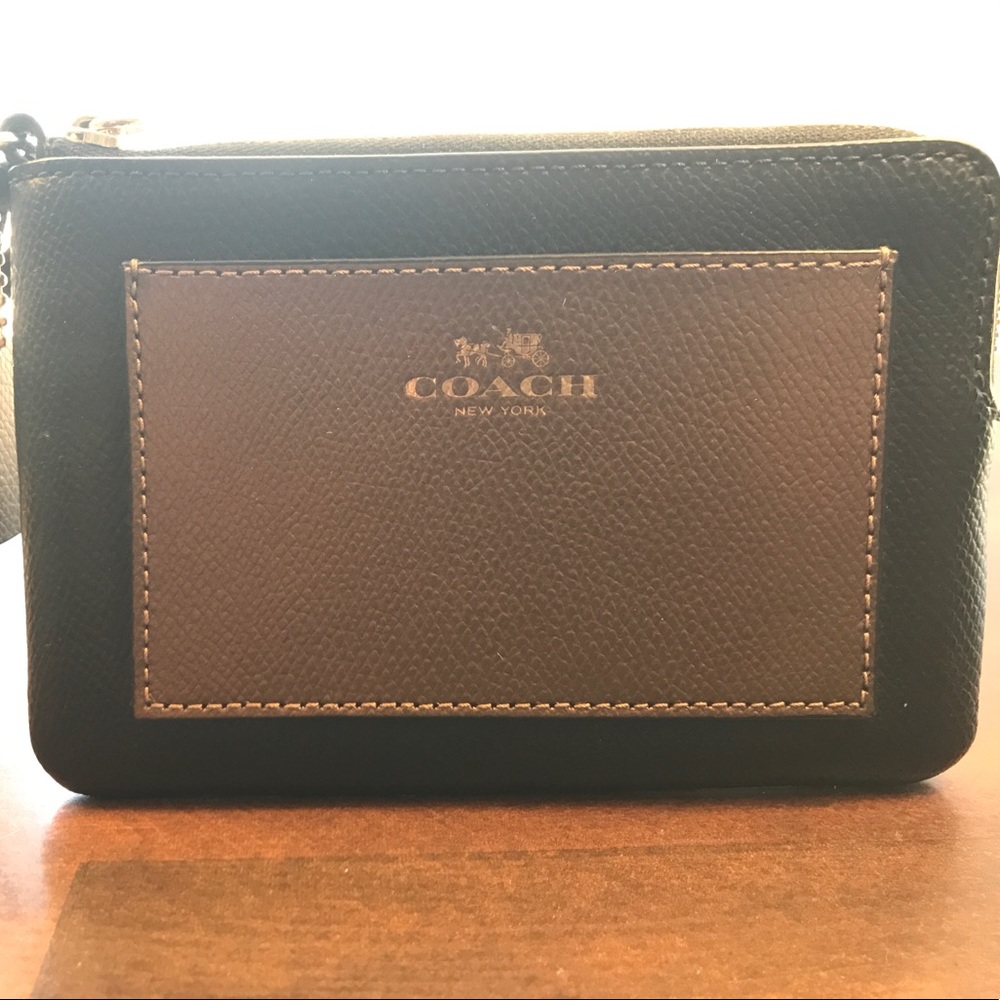 Black and brown Coach wristlet