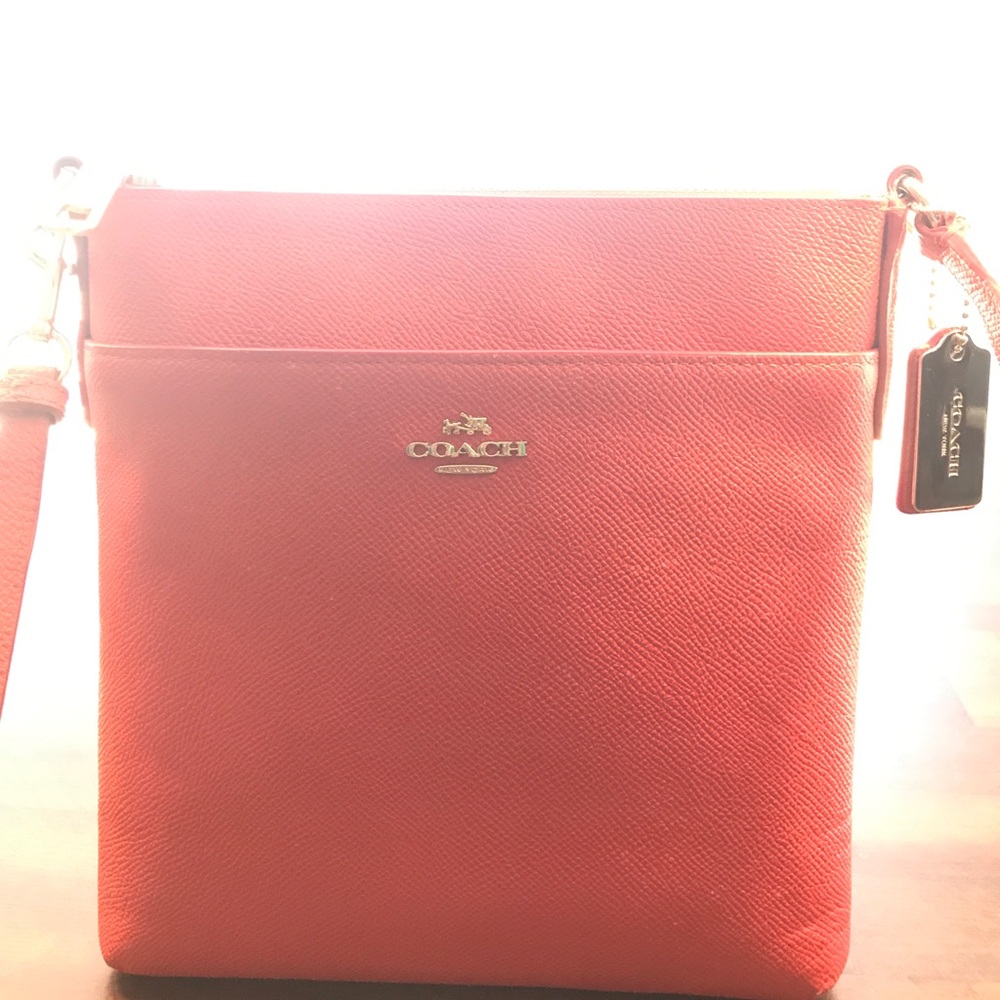 Swingpack orange crossbody Coach purse