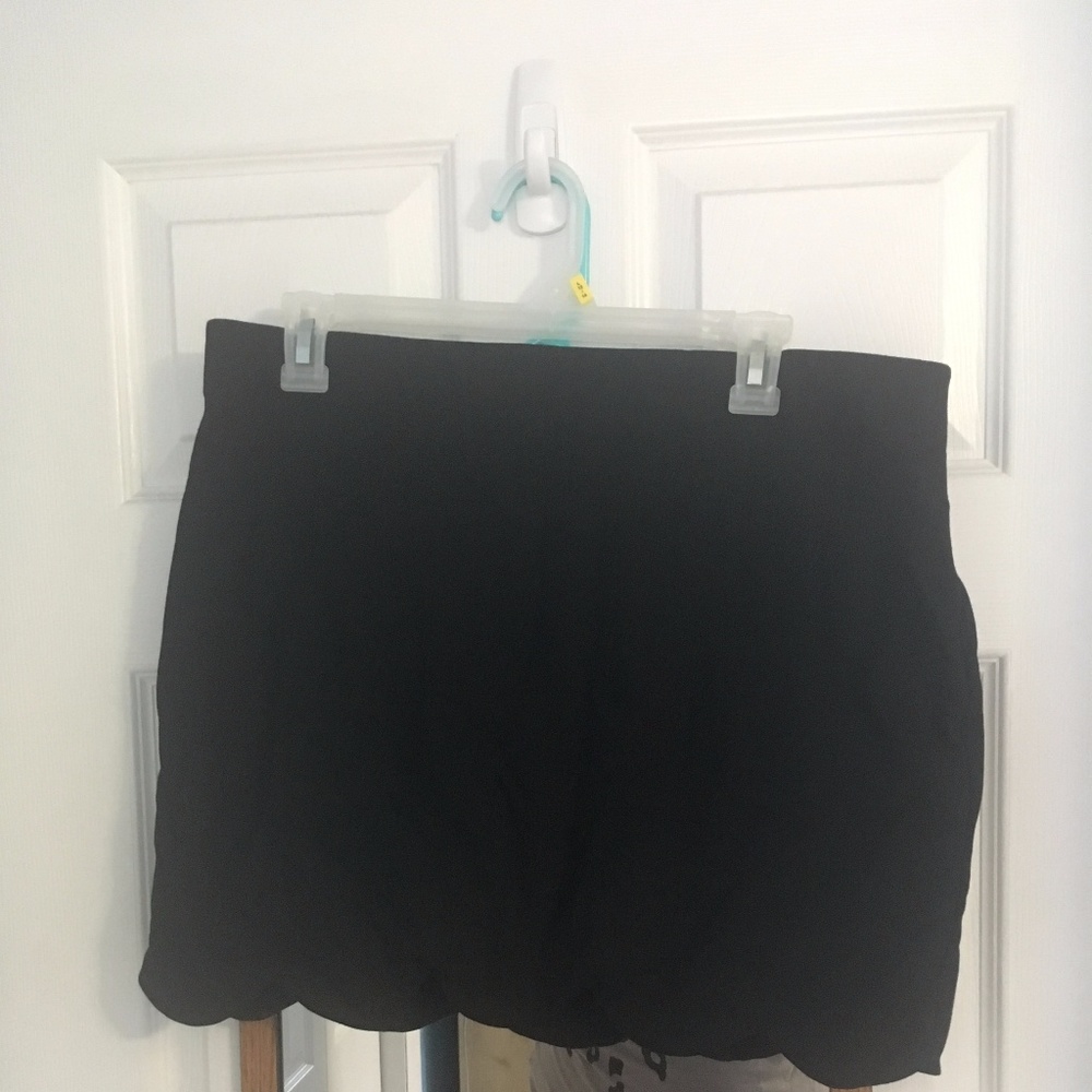 Scalloped hem black stretch skirt