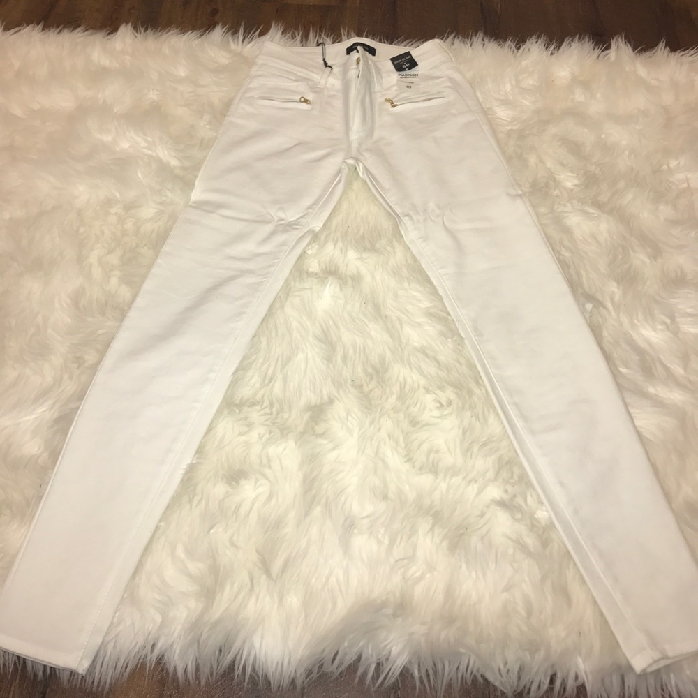 White pants with zippers