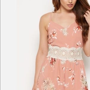 Floral romper with crochet embroidered waistline