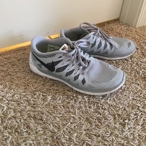 Gray Nike tennis shoes