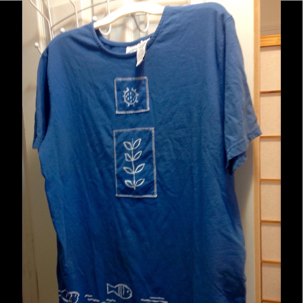 Blue cotton tee with fish border and appliqués.