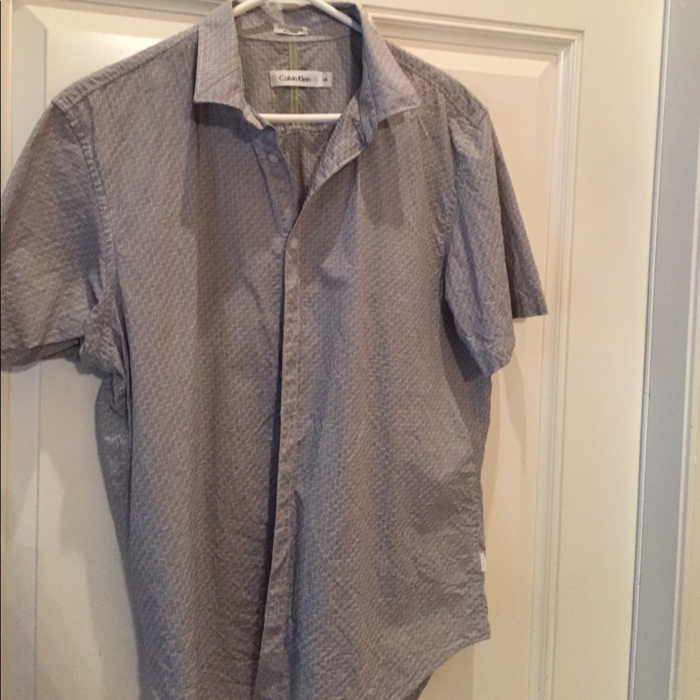 Three short sleeve button down shirts.