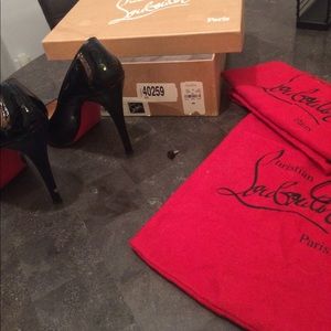 Christian Louboutin black pumps