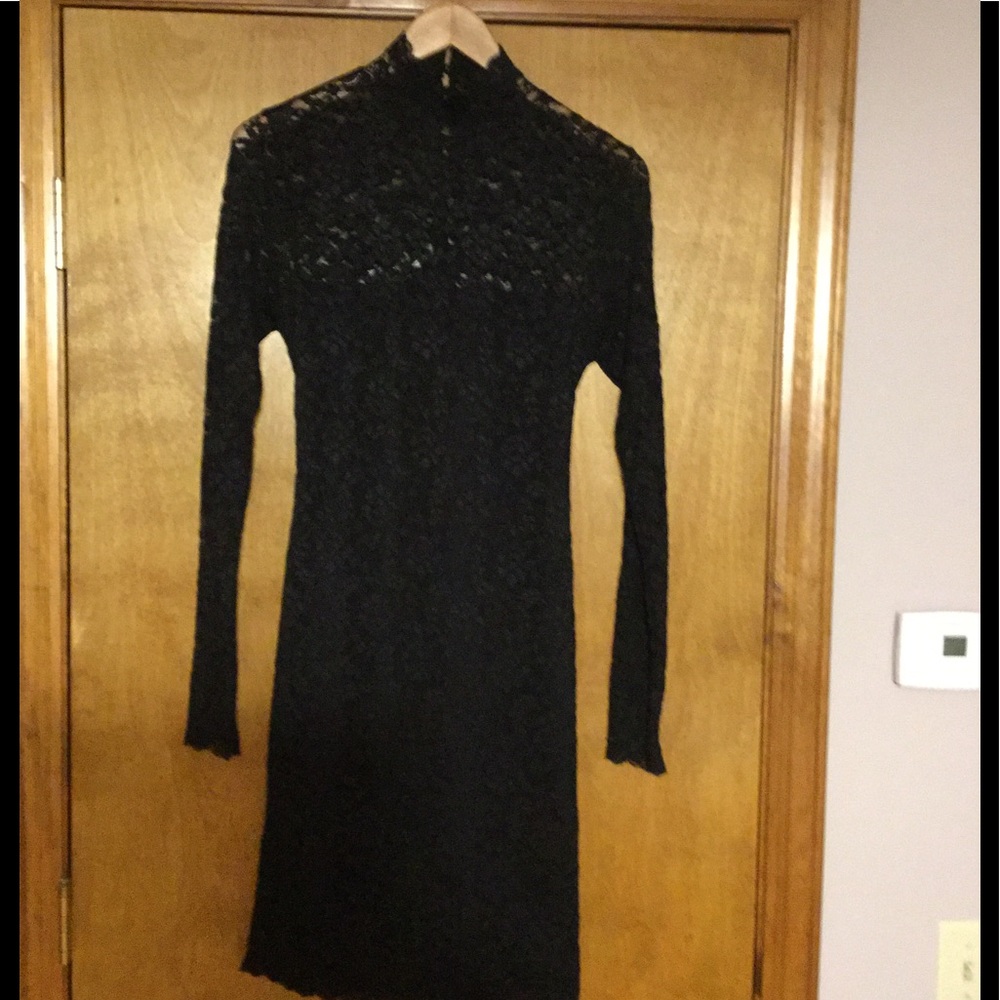 Black lace open back dress.