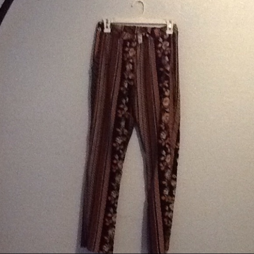 Black and pink floral pants has front pockets