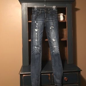 Distressed AE denim jeans