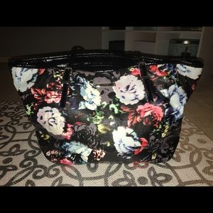 Ninewest handbag with flower design.